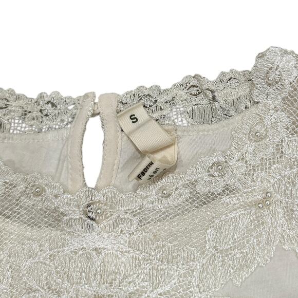 Anthropologie Tiny Long-Sleeve
Mock-Neck Lace Embellished Top - Picture 3 of 9